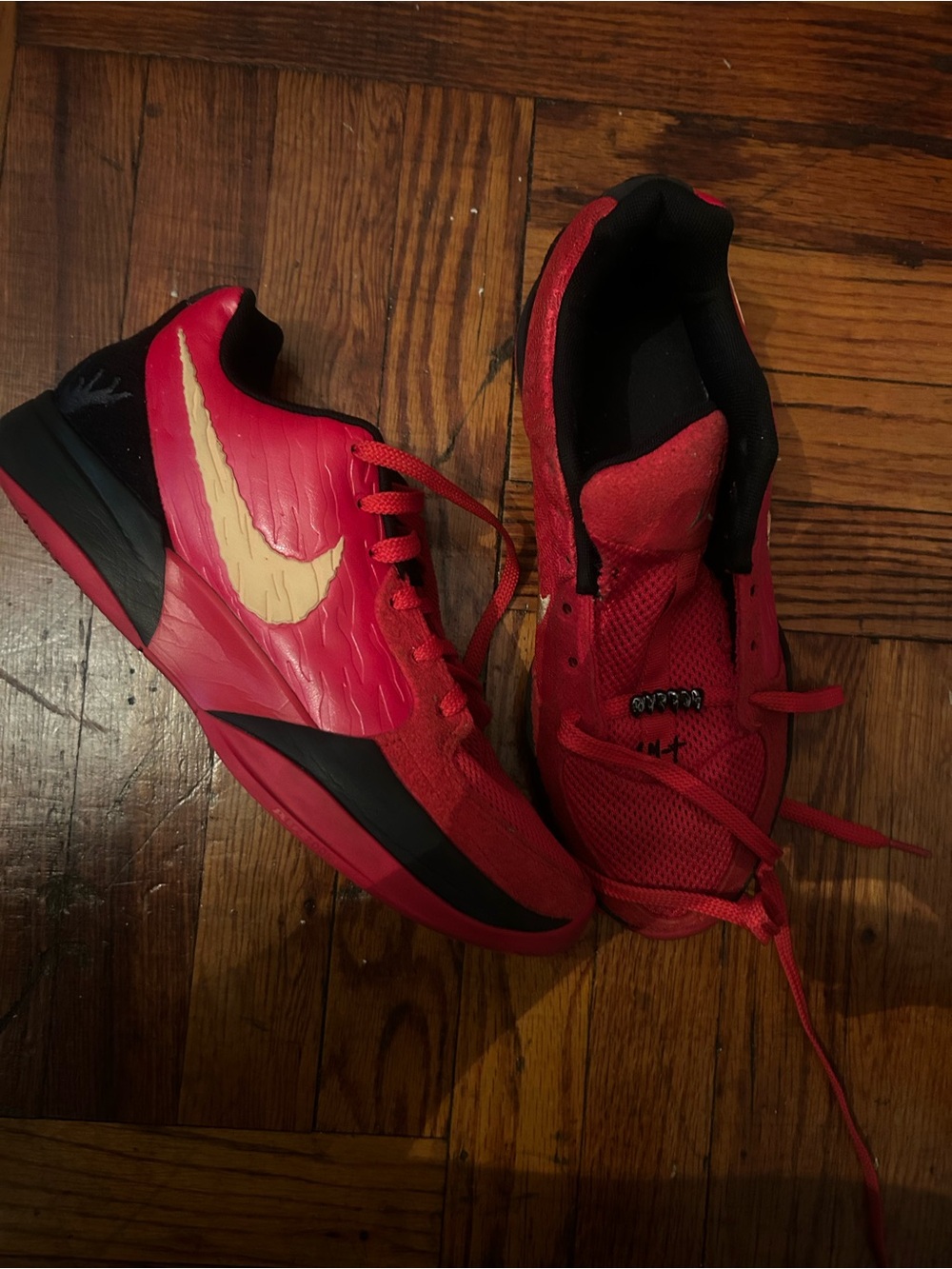 Nike Red and Black Low-Top Basketball Shoes with Cream Swoosh